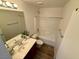 Bright bathroom features a tub/shower combo and a neutral color scheme at 10271 Headrick Dr, Las Vegas, NV 89166