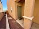 Inviting front entrance with charming door, walkway, and well-maintained landscaping at 10271 Headrick Dr, Las Vegas, NV 89166
