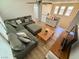 Upstairs living room featuring neutral colored walls, plank floors and a sectional couch at 10271 Headrick Dr, Las Vegas, NV 89166