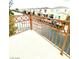 Balcony with railing offering street views of the surrounding neighborhood at 10372 Beautiful Fruit St, Las Vegas, NV 89183