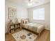Cozy bedroom with playful decor, a soft rug, and a window at 10372 Beautiful Fruit St, Las Vegas, NV 89183