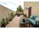 Relaxing patio area with comfortable seating, lovely plants, and dining set, perfect for outdoor living at 10372 Beautiful Fruit St, Las Vegas, NV 89183