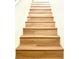 Light-wood finished stairs with a natural wood grain at 10372 Beautiful Fruit St, Las Vegas, NV 89183