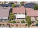 Aerial view of a home with a red tile roof and covered patio at 10409 Snowdon Flat Ct, Las Vegas, NV 89129
