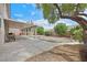 Backyard featuring a large covered patio and desert landscaping at 10409 Snowdon Flat Ct, Las Vegas, NV 89129