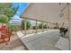 Backyard with a covered patio and desert landscaping at 10409 Snowdon Flat Ct, Las Vegas, NV 89129