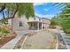 Backyard featuring a large covered patio and desert landscaping at 10409 Snowdon Flat Ct, Las Vegas, NV 89129