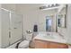 Bathroom features a bathtub and shower combination with a single vanity and toilet at 10409 Snowdon Flat Ct, Las Vegas, NV 89129