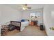 Comfortable bedroom featuring carpeted flooring and a window with natural light at 10409 Snowdon Flat Ct, Las Vegas, NV 89129
