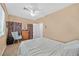 Bedroom featuring ceiling fan, area rug, and comfortable furnishings at 10409 Snowdon Flat Ct, Las Vegas, NV 89129