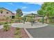 Inviting community park featuring covered picnic area, lush landscaping, and walking paths for residents to enjoy at 10409 Snowdon Flat Ct, Las Vegas, NV 89129