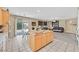 Open kitchen boasts granite countertops, stainless appliances, and a central island at 10409 Snowdon Flat Ct, Las Vegas, NV 89129