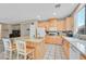 Bright kitchen with wooden cabinets and a functional center island at 10409 Snowdon Flat Ct, Las Vegas, NV 89129