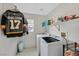 Functional laundry room with modern appliances and storage shelves at 10409 Snowdon Flat Ct, Las Vegas, NV 89129