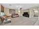 Cozy living room with a ceiling fan and view of the stairs at 10409 Snowdon Flat Ct, Las Vegas, NV 89129