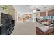 Comfortable living room with a view of the kitchen and dining area at 10409 Snowdon Flat Ct, Las Vegas, NV 89129