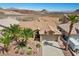 Aerial view of a single-Gathering home with desert landscaping and a tile roof at 1043 Armillaria St, Henderson, NV 89011