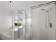 Modern shower and tub combo with clear glass and great views at 1043 Armillaria St, Henderson, NV 89011