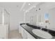 Bright bathroom featuring double sinks with granite countertops and glass shower at 1043 Armillaria St, Henderson, NV 89011
