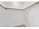 Walk-in closet with ample storage space and neutral carpeting at 1043 Armillaria St, Henderson, NV 89011