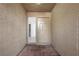 Welcoming entryway with neutral walls, brick flooring and sidelight window at 1043 Armillaria St, Henderson, NV 89011