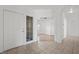 Inviting entryway with tile floors, leading to a bedroom with wood floors at 1043 Armillaria St, Henderson, NV 89011