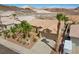 Charming single-story home with a well-manicured lawn, mature palm trees, and a spacious driveway at 1043 Armillaria St, Henderson, NV 89011