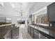 Bright kitchen with stainless appliances, granite counters, and views of the backyard at 1043 Armillaria St, Henderson, NV 89011