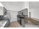 Kitchen featuring granite countertops, stainless steel appliances, and tile floors at 1043 Armillaria St, Henderson, NV 89011