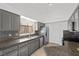 Updated kitchen features stainless steel appliances and granite countertops at 1043 Armillaria St, Henderson, NV 89011