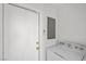 Convenient laundry room with a washing machine, dryer, and storage cabinet at 1043 Armillaria St, Henderson, NV 89011