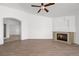 Large living room features ceiling fan, hardwood floors, fireplace, and an open floor plan at 1043 Armillaria St, Henderson, NV 89011