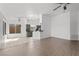 Spacious living room with wood floors, a ceiling fan, and an open floor plan at 1043 Armillaria St, Henderson, NV 89011