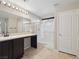 The primary bathroom offers dark cabinets, a vanity, and a glass enclosed shower at 10609 Sand Mountain Ave, Las Vegas, NV 89166