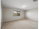 A spacious bedroom features neutral carpet and a window with natural light at 10609 Sand Mountain Ave, Las Vegas, NV 89166