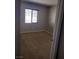 Neutral bedroom featuring a window with blinds and plush carpeting at 10609 Sand Mountain Ave, Las Vegas, NV 89166