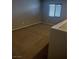 Bedroom featuring neutral walls and carpet, with natural light coming through a window at 10609 Sand Mountain Ave, Las Vegas, NV 89166