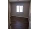 Bedroom with modern flooring, neutral walls, and ample natural light from a window at 10609 Sand Mountain Ave, Las Vegas, NV 89166
