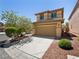 Charming two-story home with a well-maintained lawn and inviting curb appeal at 10609 Sand Mountain Ave, Las Vegas, NV 89166