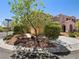 Charming home with desert landscaping and lovely shade trees on a corner lot at 10609 Sand Mountain Ave, Las Vegas, NV 89166