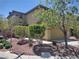 Charming two-story home with a well-manicured front yard, mature landscaping, and an attached two-car garage at 10609 Sand Mountain Ave, Las Vegas, NV 89166
