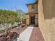 Inviting front entrance with a walkway leading to the front door and decorative rock landscaping at 10609 Sand Mountain Ave, Las Vegas, NV 89166