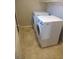 The laundry room features modern washer and dryer units at 10609 Sand Mountain Ave, Las Vegas, NV 89166