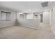 Large carpeted loft space with a large window for natural light at 10609 Sand Mountain Ave, Las Vegas, NV 89166