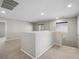 Open loft area with neutral carpet, paint, and natural light from the window at 10609 Sand Mountain Ave, Las Vegas, NV 89166