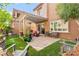 Charming backyard with a covered patio, comfortable seating, and well-maintained landscaping at 11294 Corsica Mist Ave, Las Vegas, NV 89135
