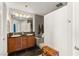 Bathroom featuring dual vanities, and a tiled glass-enclosed shower at 11294 Corsica Mist Ave, Las Vegas, NV 89135