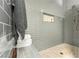 Contemporary bathroom features gray subway tile shower with built in niche and bench at 11294 Corsica Mist Ave, Las Vegas, NV 89135