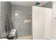 Modern bathroom with gray subway tile shower, bench, and built-in niche at 11294 Corsica Mist Ave, Las Vegas, NV 89135