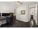 Bedroom with dark hardwood floors, large window and view to vanity area at 11294 Corsica Mist Ave, Las Vegas, NV 89135